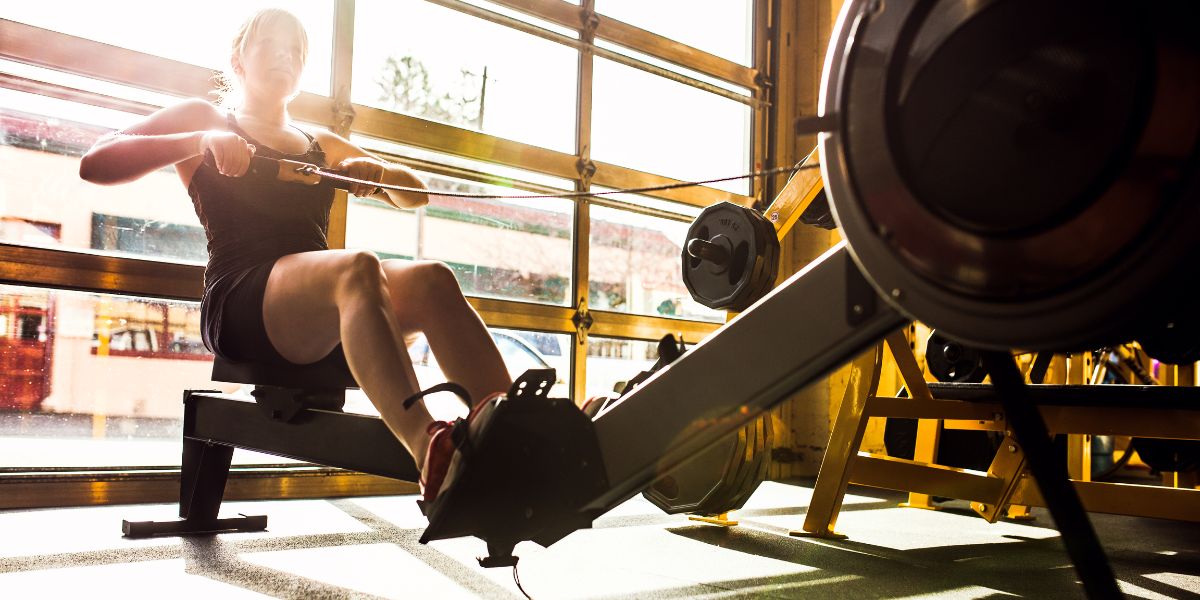 How Does Using a Rowing Machine Enhance Cardio and Strength?